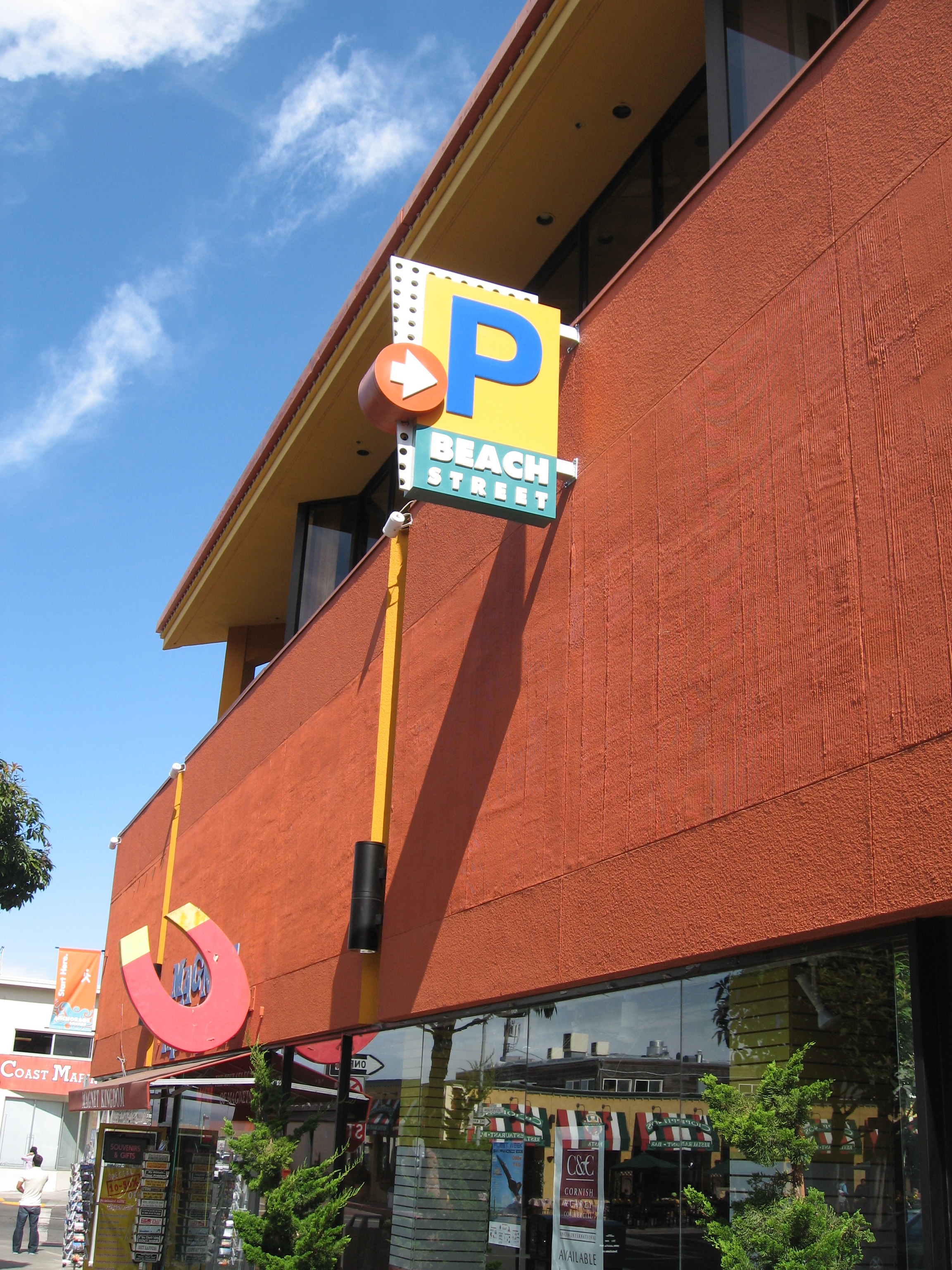 P and Beach Street directional blade sign mounted on the building