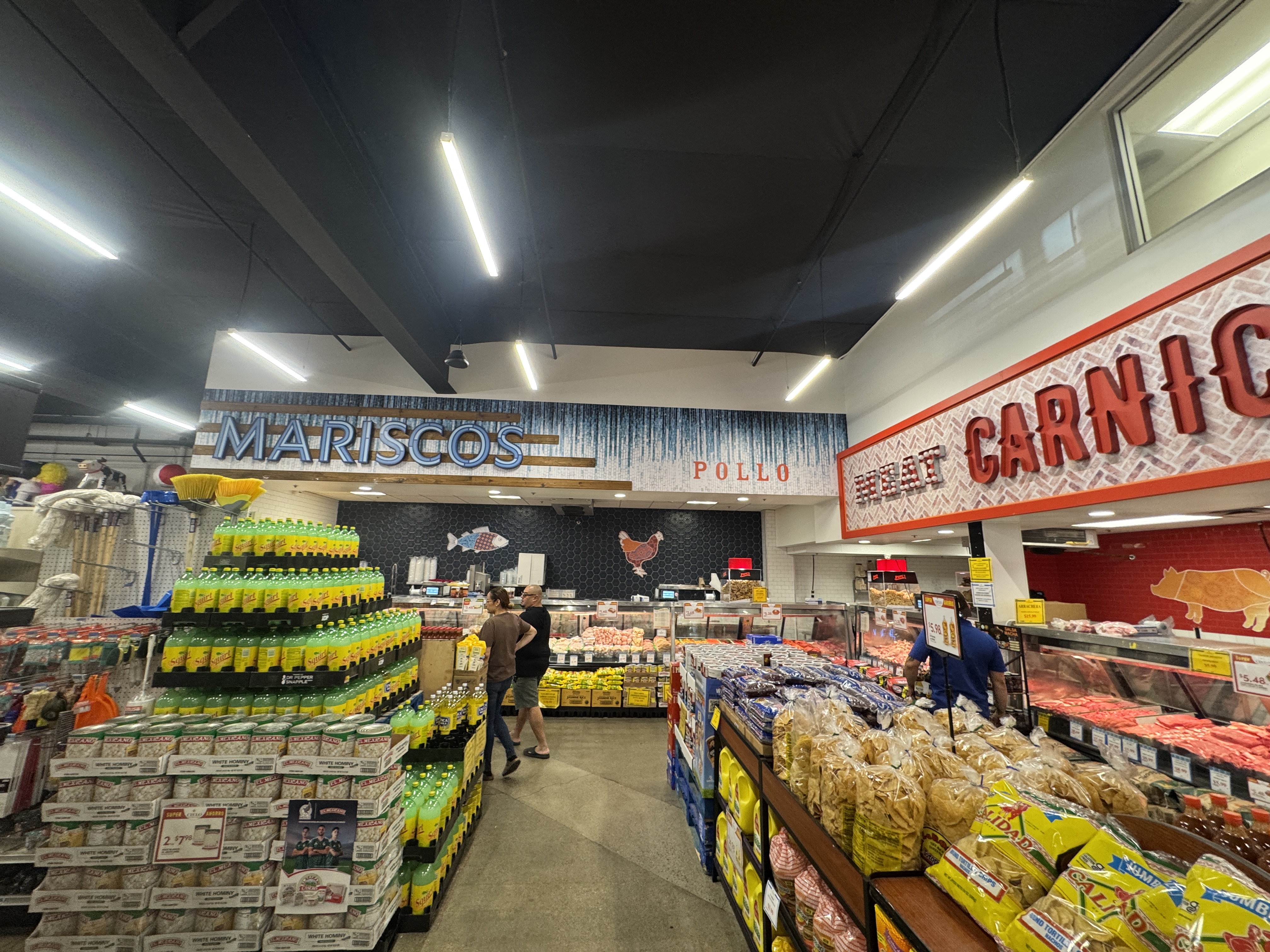 Mariscos and Carniceria department signs