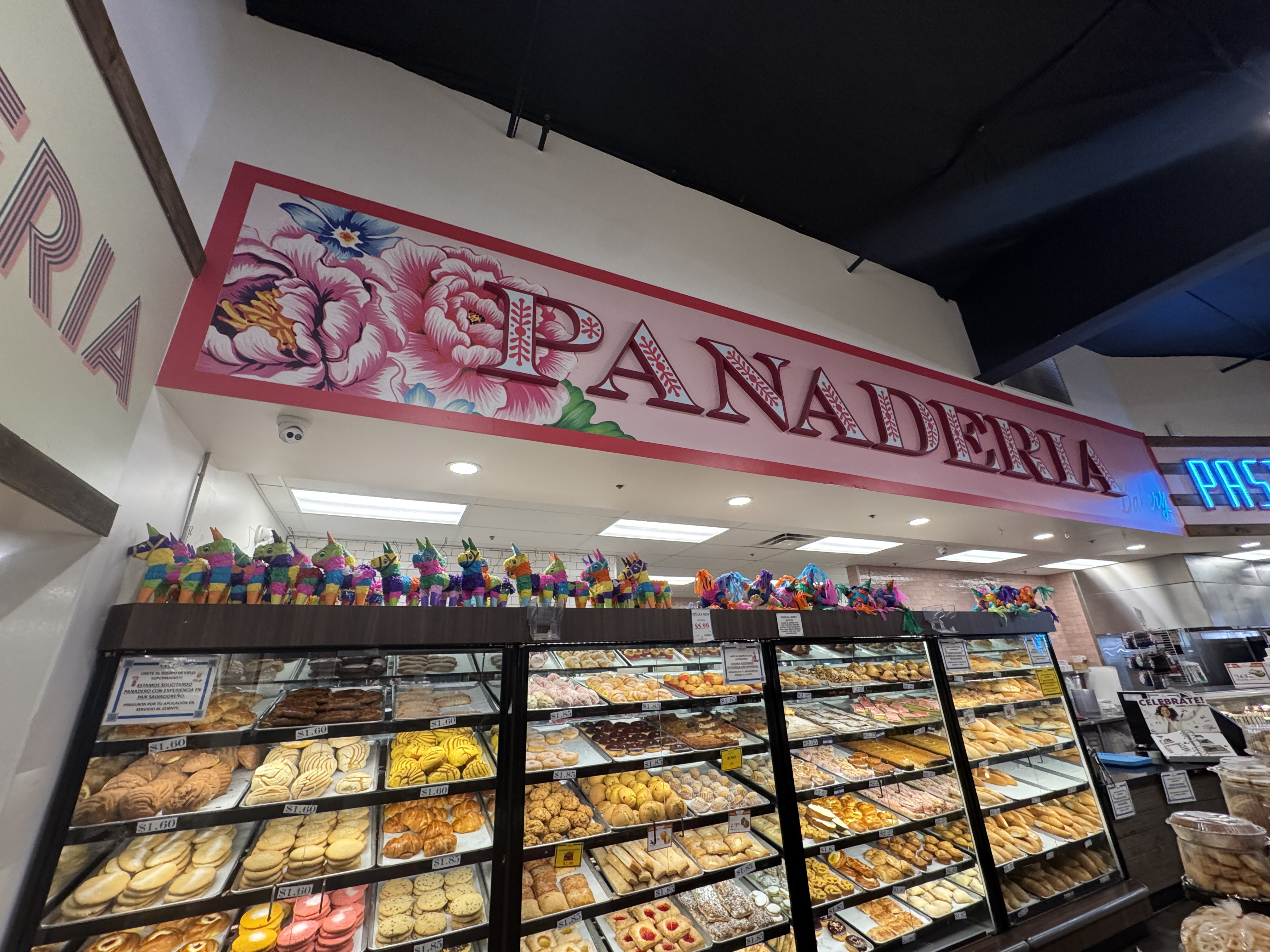 Panaderia hand-painted floral sign