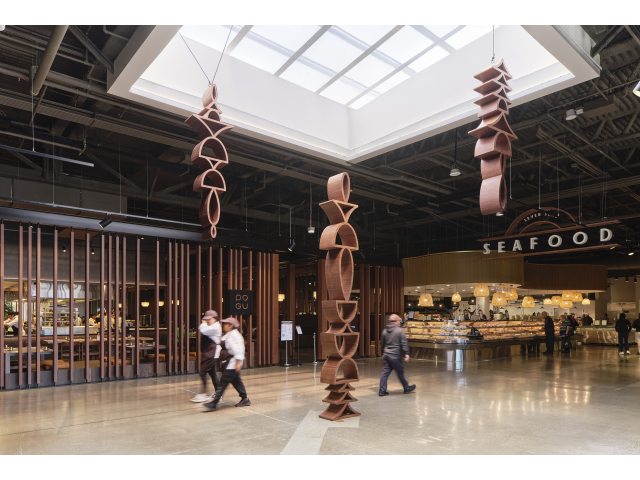 Suspended wood sculpture in atrium
