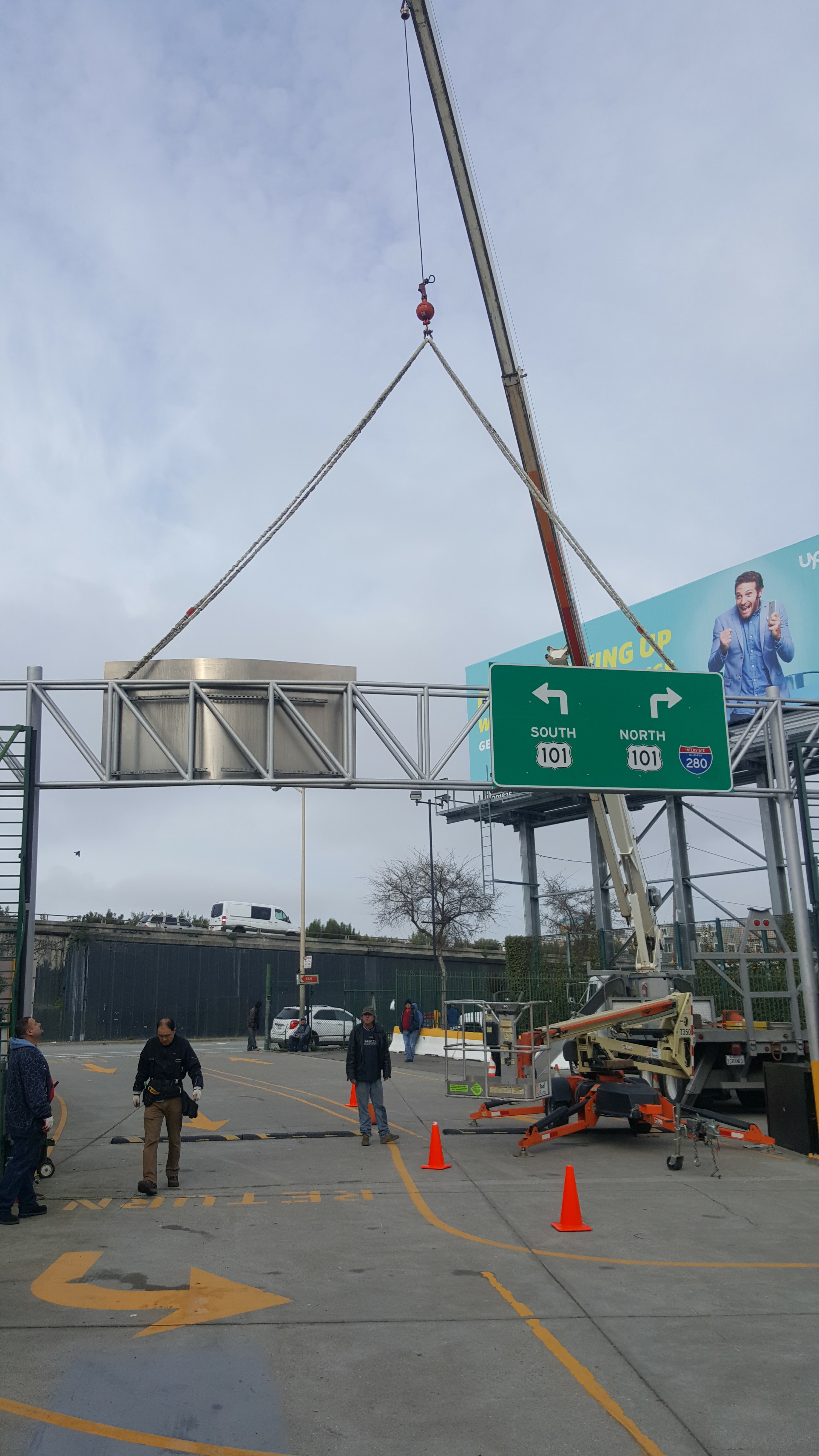 DT Signs crew craning a large sign structure into place