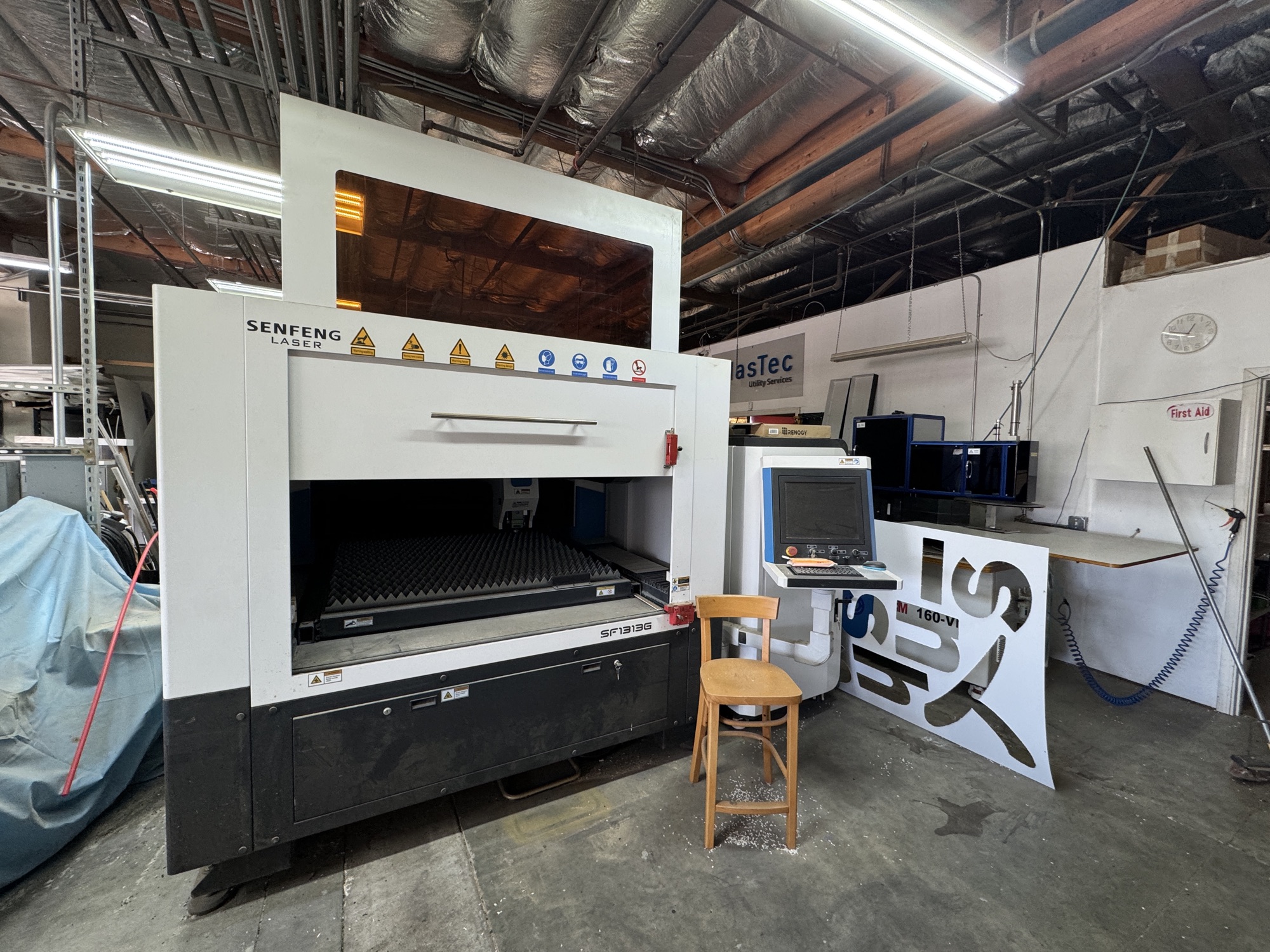 Senfeng SF1313 fiber laser cutter in operation