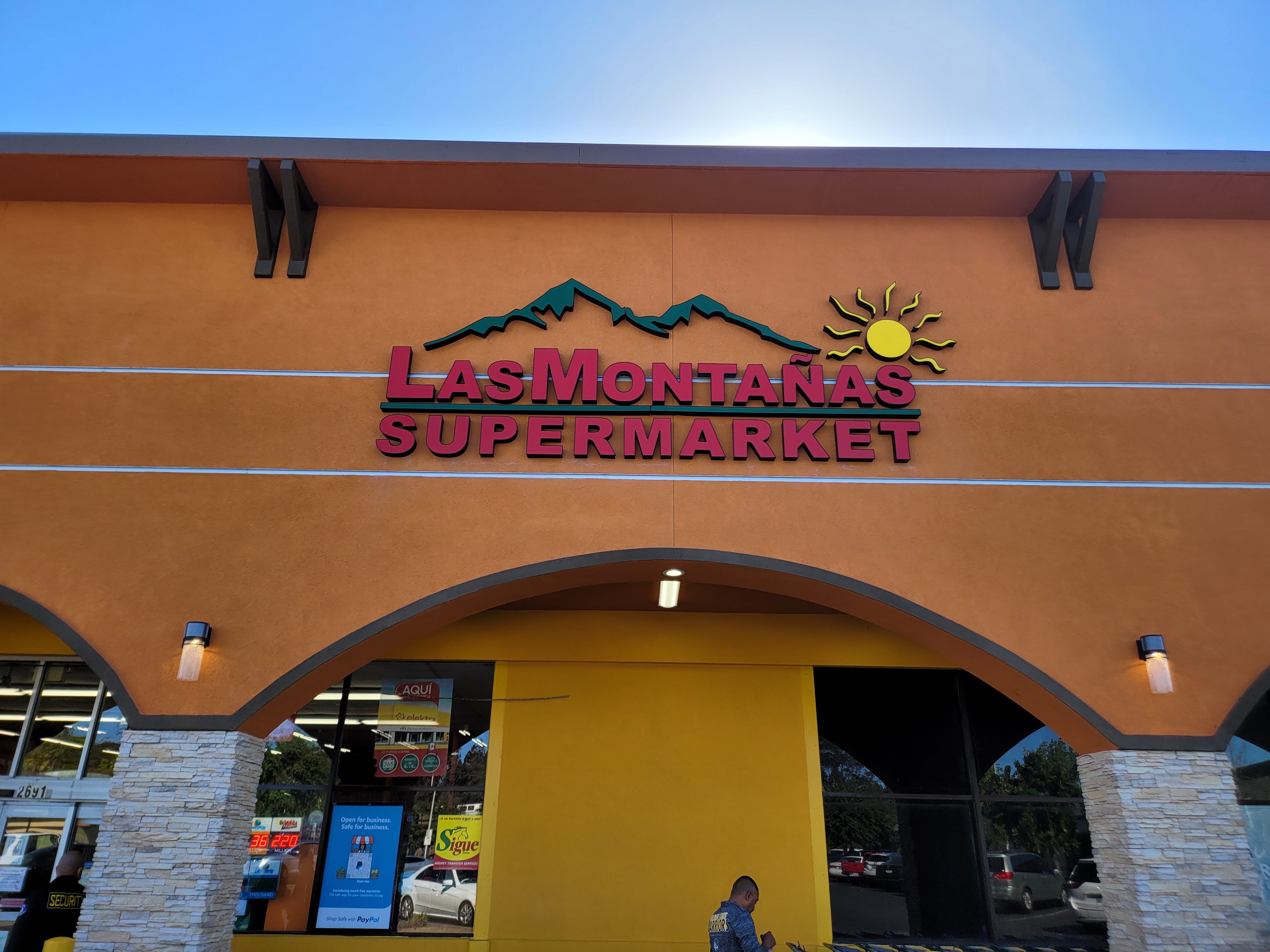 Las Montañas exterior channel letters with mountain and sun logo
