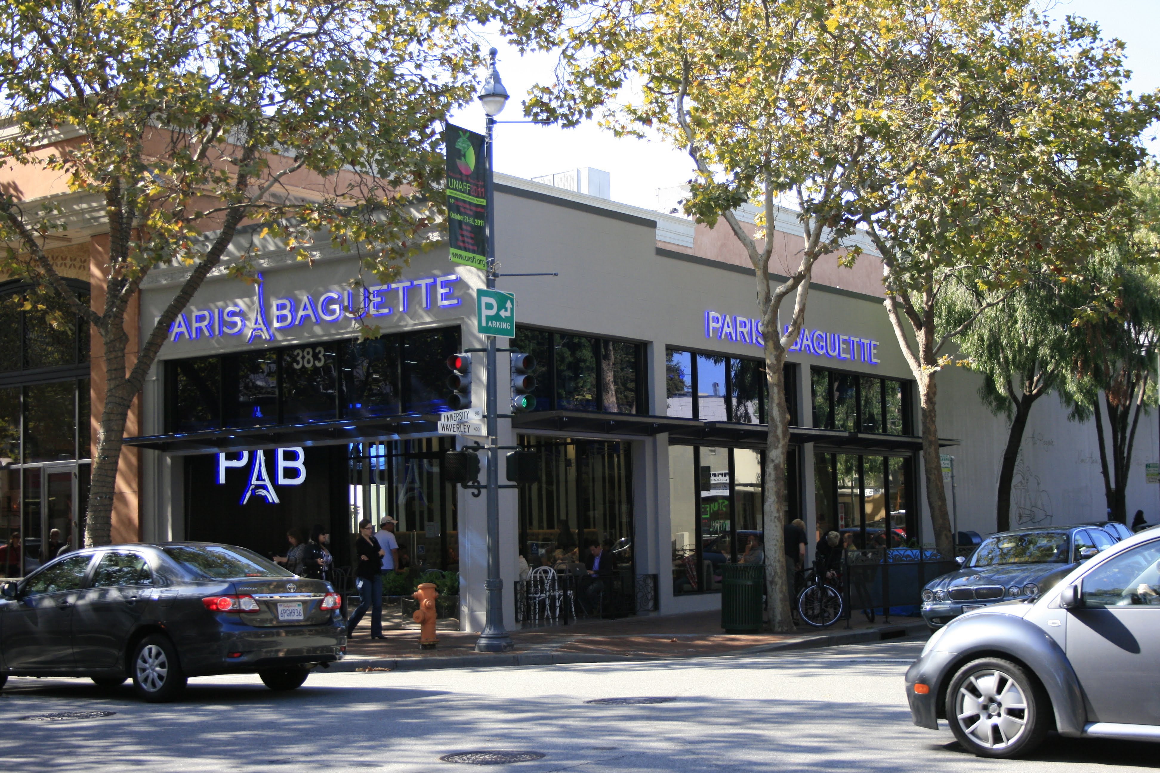 Paris Baguette corner storefront with signage on both faces and PAB logo