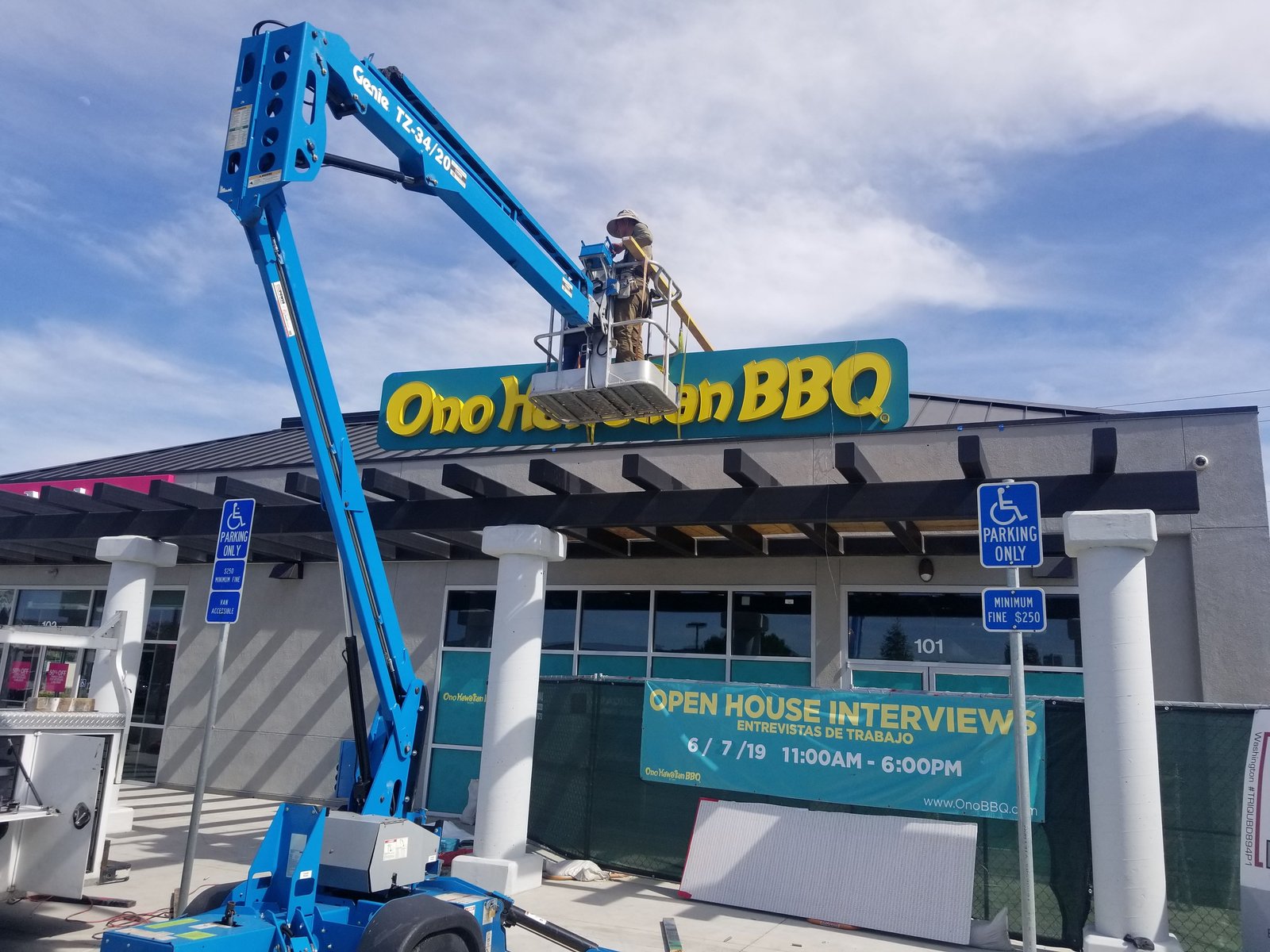 Genie boom lift installing Ono Hawaiian BBQ channel letters
